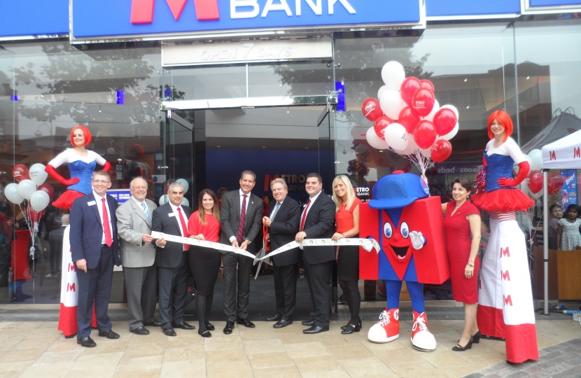 David Evennett MP pictured cutting the ribbon to open the branch.